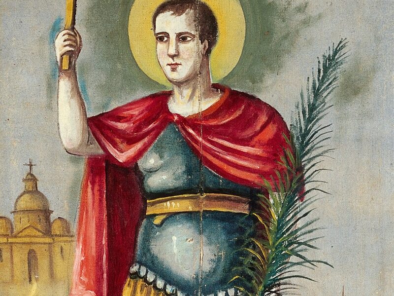 San Expedito vestido de soldado romano con la cruz en alto, la palma del martirio y el cuervo a sus pies